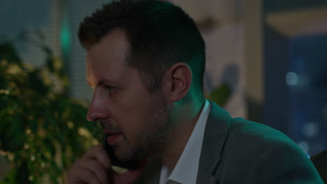 businessman on a phone call at night