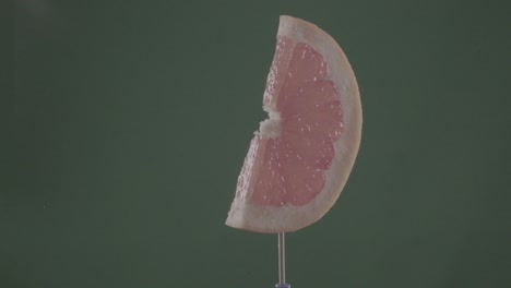 grapefruit rotating with loop on green screen for chroma key