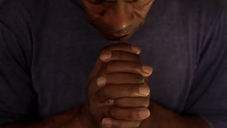 man praying to god with hands together on grey background stock video