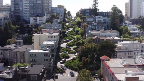 Rising-close-up-aerial-shot-of-cars-going-down-the-famous-crooked-Lombard-Street-on-Russian-Hill-in-San-Francisco,-California