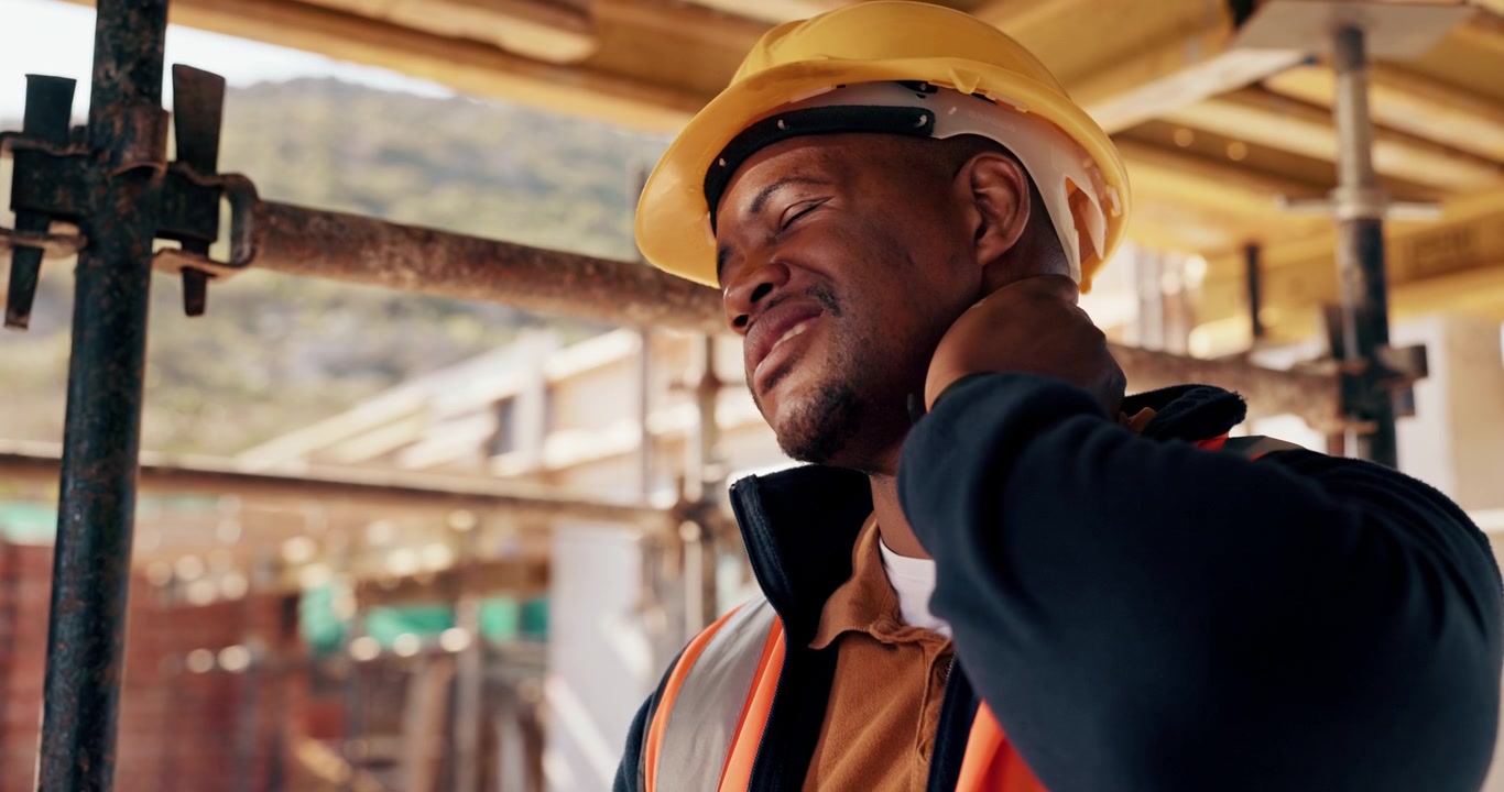 Construction Worker Suffering From Neck Pain on Site