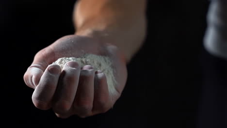 hand scattering white powder