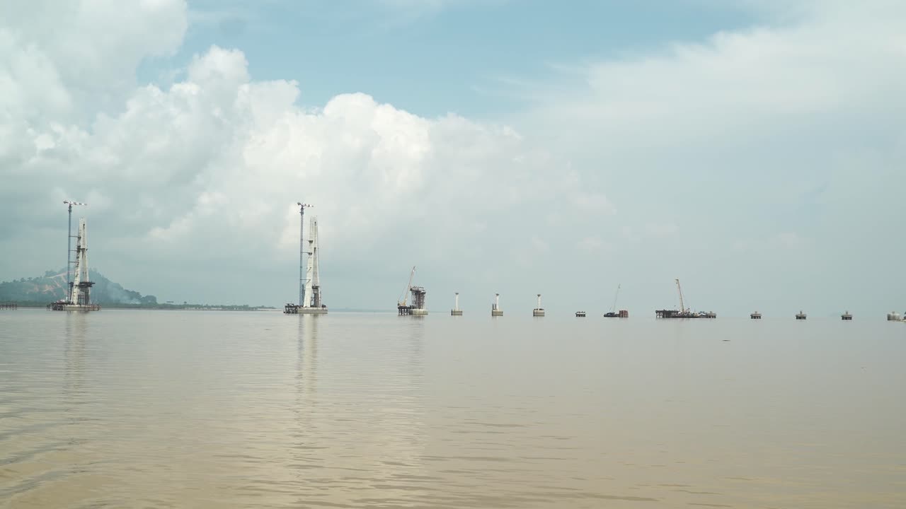Batang Lupar Sarawak River Ferry Ride View During Summer And Under Construction Longest Bridge Conecting From each side,Sarawak,Borneo.