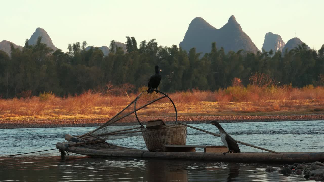 Scenic Li River View with Birds and Traditional Bamboo Boat