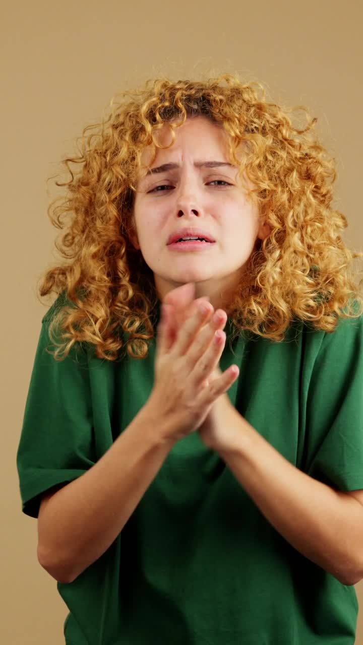 Woman feeling cold, shivering, and trying to warm up