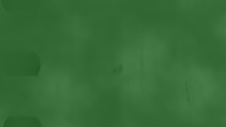 Dark grunge texture with green splashes and noise effect