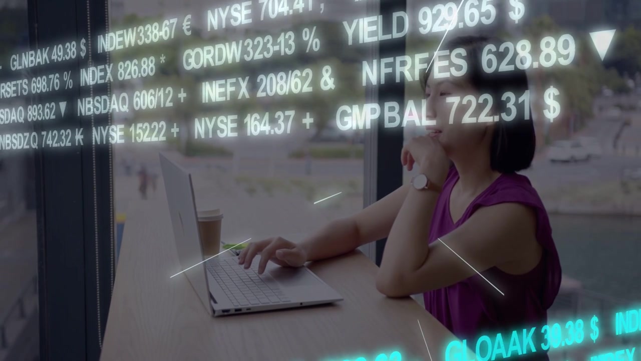Woman typing on laptop by window, market ticker sweeping, pausing her typing, tracking finance