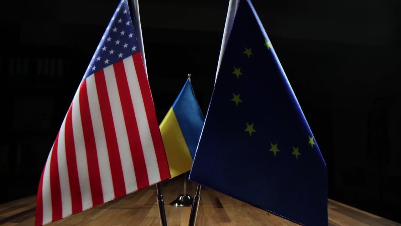Flag of Ukraine on a wooden table