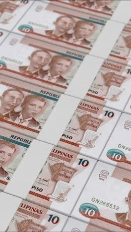 vertical video of 10 philippine peso banknotes printed by a money press