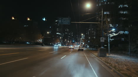 Wide-dynamic-shot-of-a-Night-street-with-cars,-West-End,-Vancouver