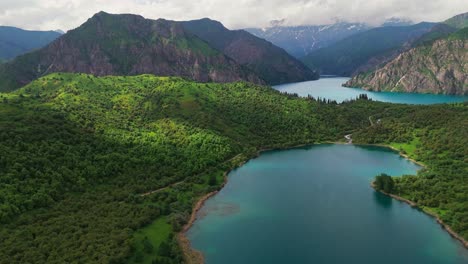 stunning aerial footage of sary-chelek lake, kyrgyzstan. biosphere reserve is a pristine natural wonder in central asia