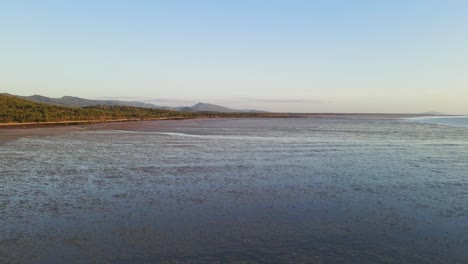 Drone-Flyby-Over-Mudflats-By-The-Coast-Of-Isaac-Region-During-Low-Tide