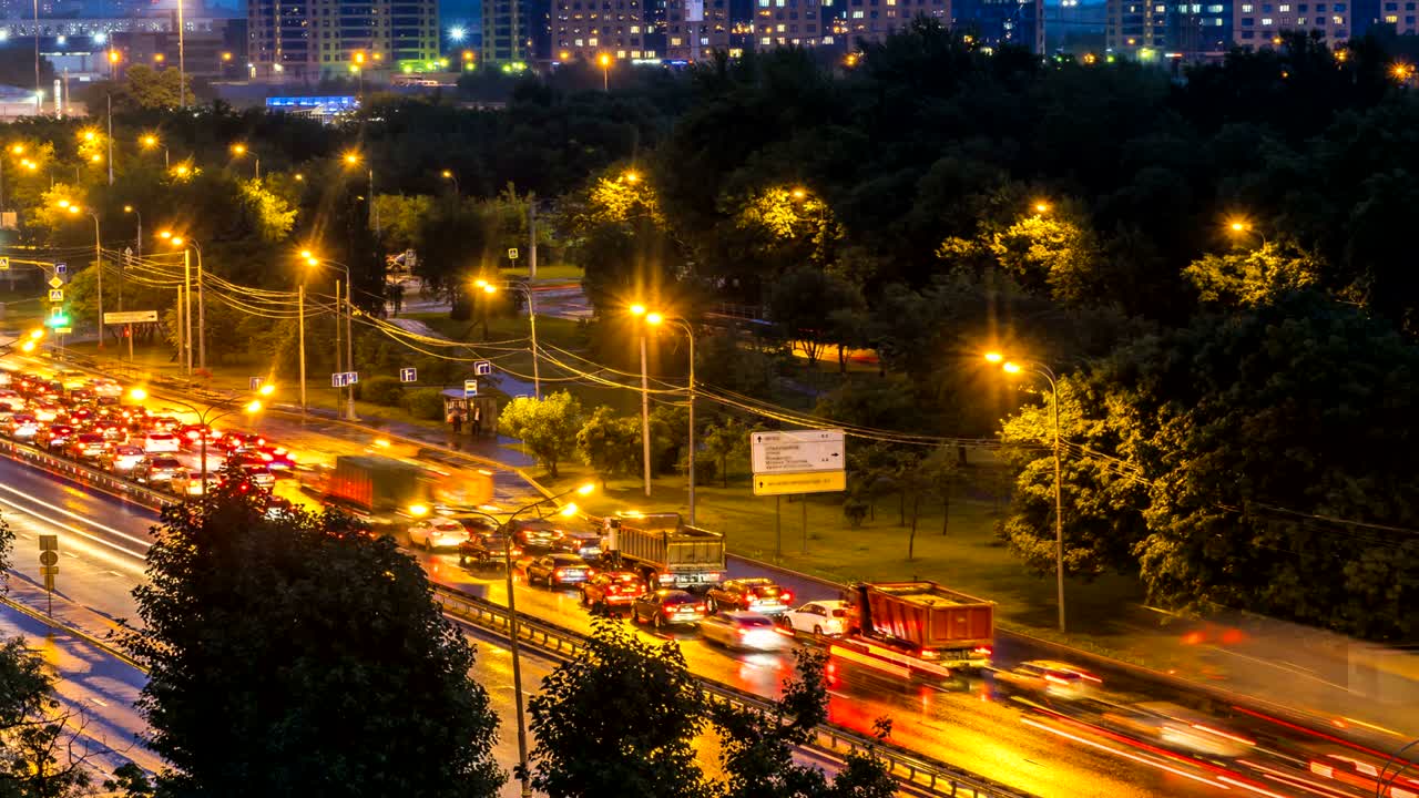 night panoramic view of traffic and Windows of houses on the outskirts of the metropolis, time lapse