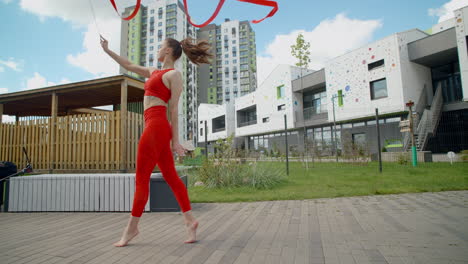 woman performing ribbon acrobatics