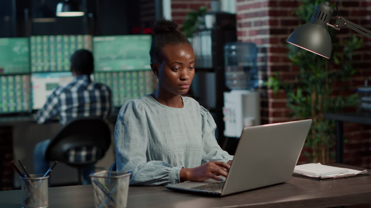 Female investor creating selling profit with trade statistics