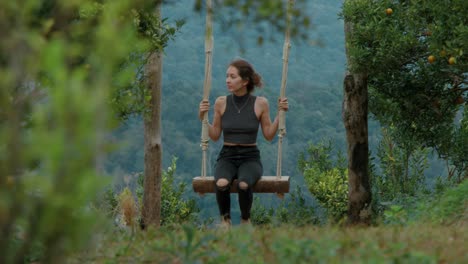 woman swinging in nature