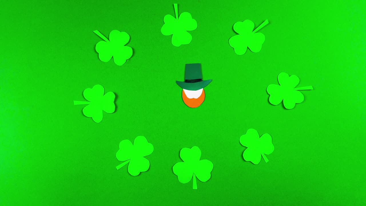 4k Greeting card for St. Patrick's Day, which is celebrated on March 17. Irish cultural holiday. Symbols of feast a shamrocks and leprechauns. Green background.