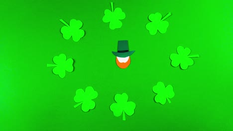 tarjeta de felicitación 4k para el día de san patricio, que se celebra el 17 de marzo. fiesta cultural irlandesa. símbolos de la fiesta un trébol y leprechauns. fondo verde.