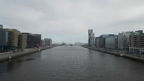 drone shot of dublin's docklands and the river liffey