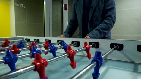 person playing foosball