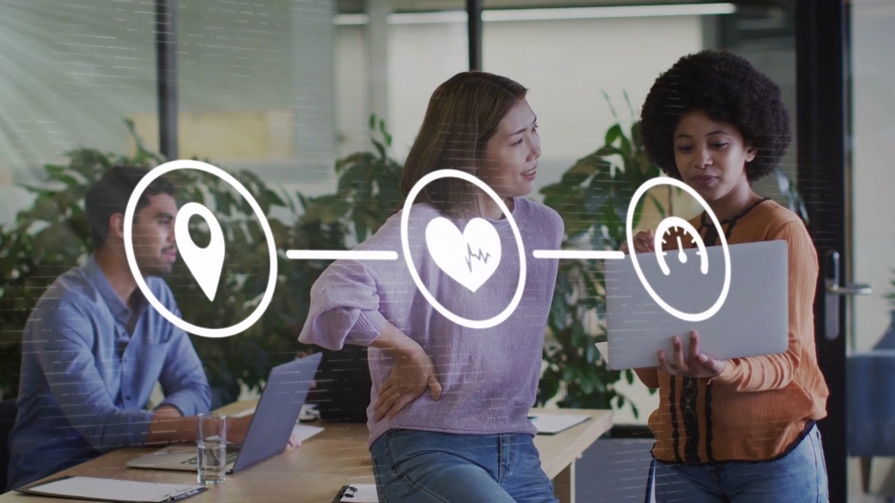 Presenter pointing at laptop, causing animated location pin, heart, gauge overlaying for business