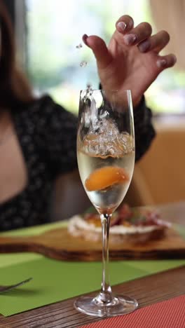 woman enjoying a bubbly drink at a restaurant