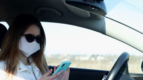 sick girl wearing protection during pandemic. pretty young caucasian girl taking on medical mask outdoor. girl wearing medical mask during coronavirus covid-19 epidemic
