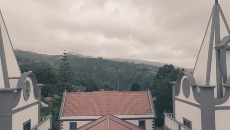 cloudy sky over prazeres church towers, madeira