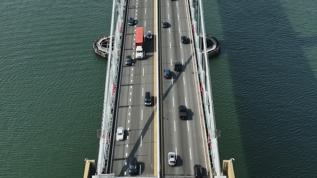 Busy traffic on a New York bridge captured from above during daylight