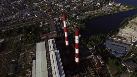 Chimney-on-industrial-plant-in-city.-Aerial-view-industrial-pipe-on-factory-area