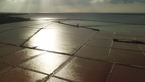 Drone-view-of-the-salt-lakes-at-Salina-Grande,-Sicily,-Italy