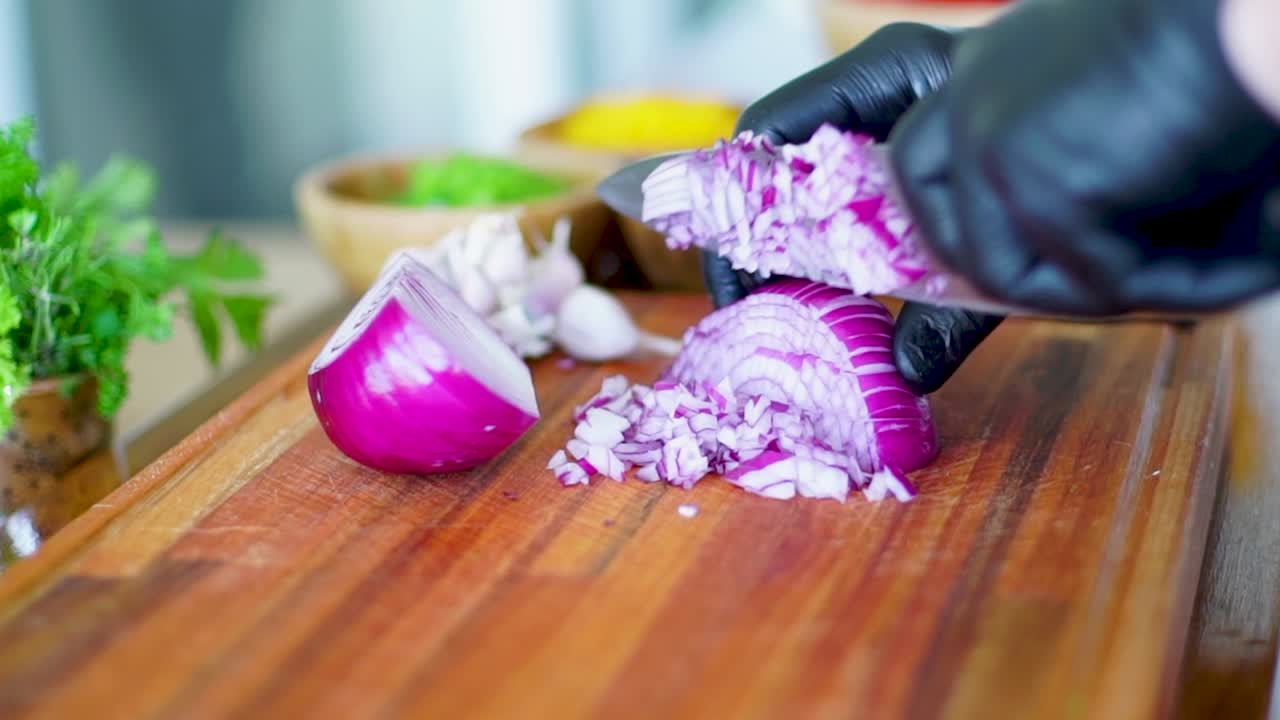 Gloved Chef Dicing Fresh Red Onion, Wooden Board Vegetables Food Cutting in Slow Motion