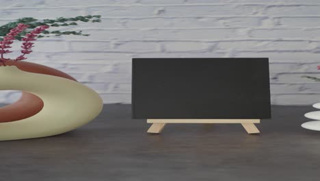 Black Chalkboard on Wooden Easel with Decor