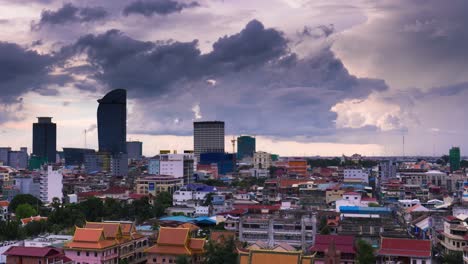 Phnom-Penh-Cityscape---clouds-with-crane-in-background,-zoom-out