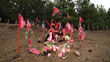 A-wayside-shrine-to-Gauchito-Gil-in-Argentina,-static-medium-shot