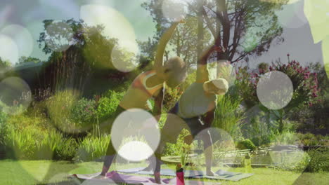 Animation-of-light-spots-over-african-american-couple-doing-yoga,-stretching,-slow-motion