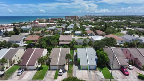 rows of coastal homes leading towards the beach with ocean views