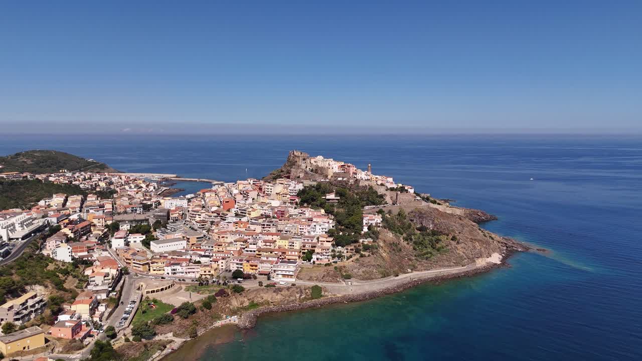 Aerial view of Castelsardo, Sardinia, with vibrant buildings and blue sea