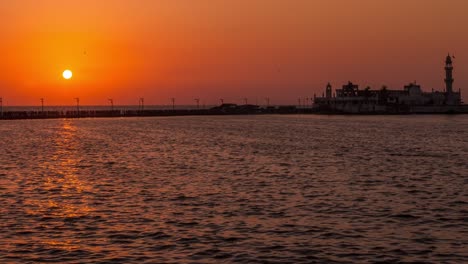 time-lapse of haji ali dargah during a beautiful sunset, mumbai, india