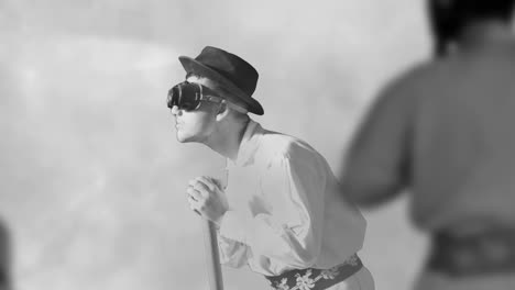 after effects composition - steel worker puts on his protective eyewear and, watching in the furnance