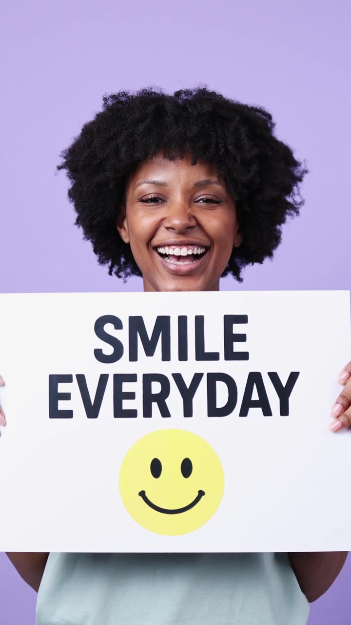 Joyful African American Woman Holding 'Smile Everyday' Sign