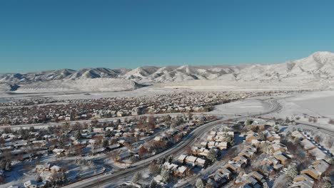 a drone pan over a residential area after a spring snow