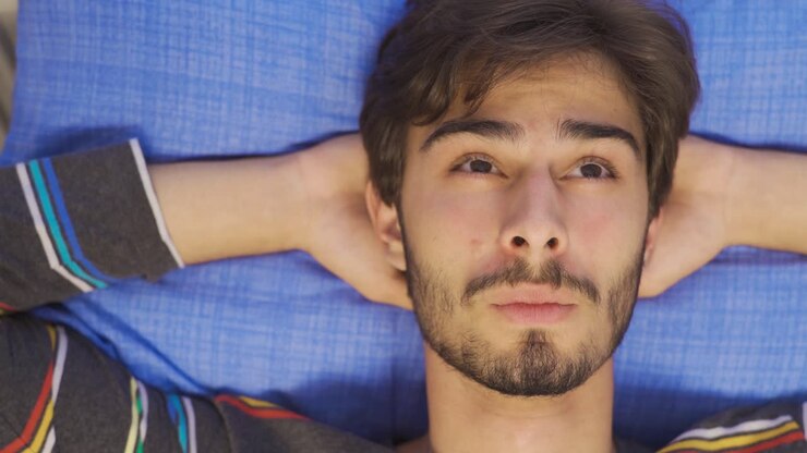 Portrait of happy young man. To dream.