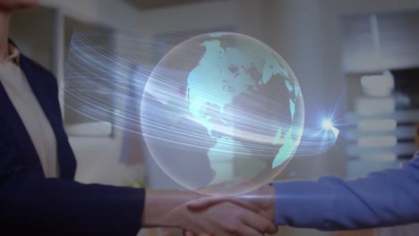 light trails over a globe against mid section of businessman and businesswoman shaking hands