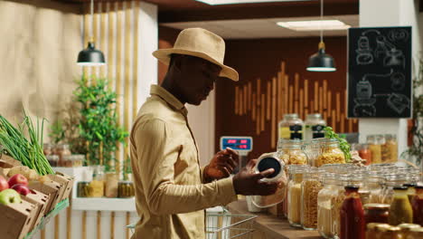 client examines cereals and grains at zero waste eco store