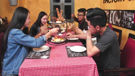 friends enjoying dessert in a cafe