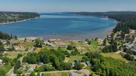 Aerial-orbiting-shot-of-Holmes-Harbor-in-Freeland,-Washington