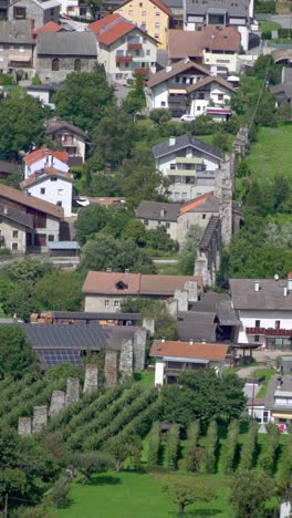 Aerial View of a European Village with Stone Walls and Ruins