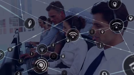 Animation-of-network-of-connection-with-icons-over-business-people-wearing-phone-headsets