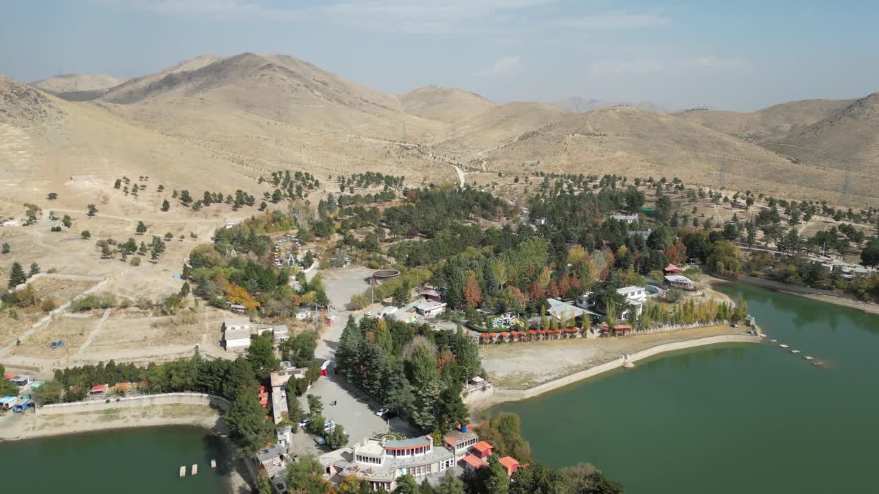 Drone over Qargha Water Reservoir, West of Kabul, Afghanistan. Drone Shot of Lake, Lakefront Buildings and Landscape